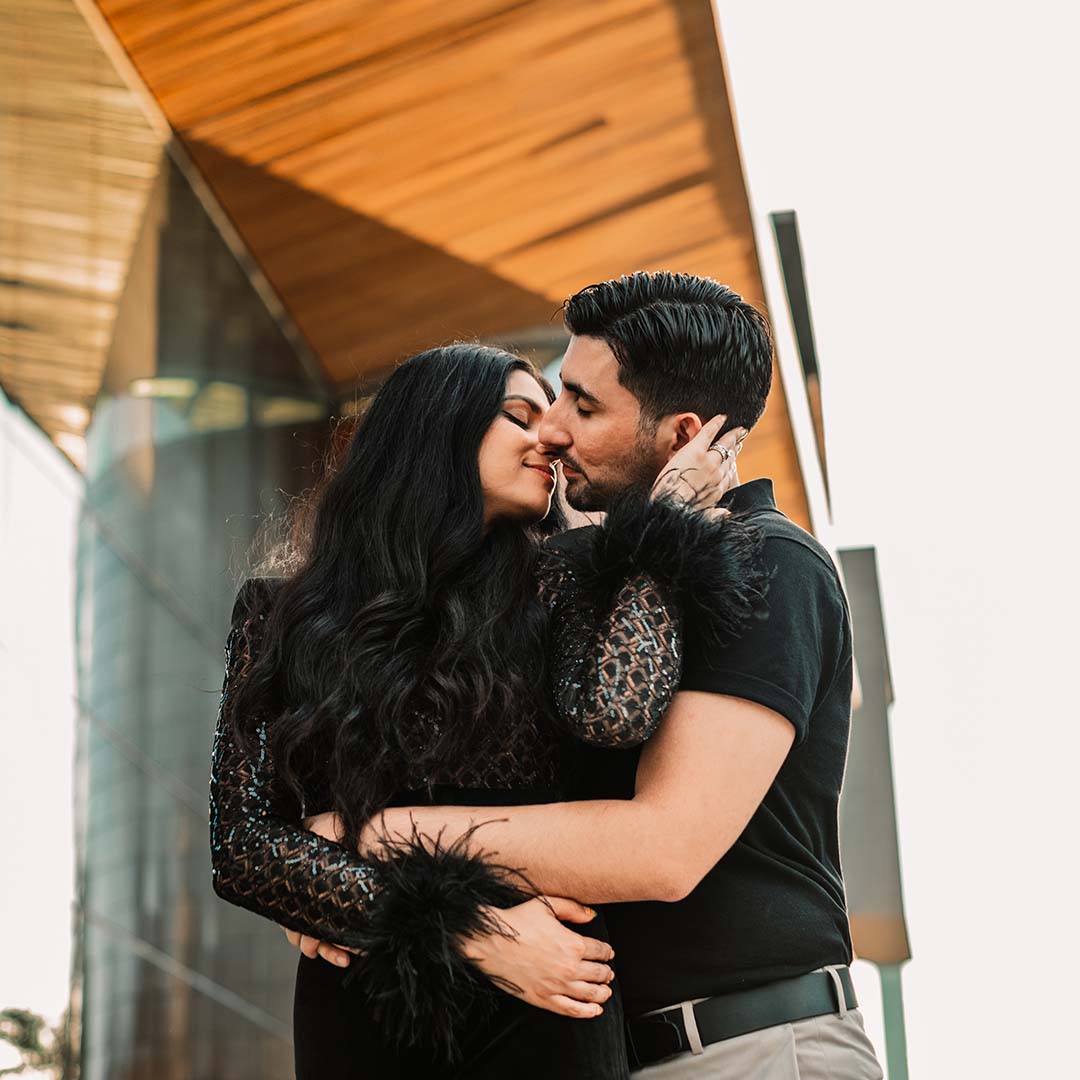 Portrait of a couple in an urban setting by Kristina Wikle